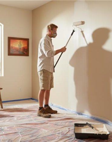 Residential painting services team preparing walls in Arizona home