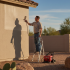 Professional exterior painters working on residential property